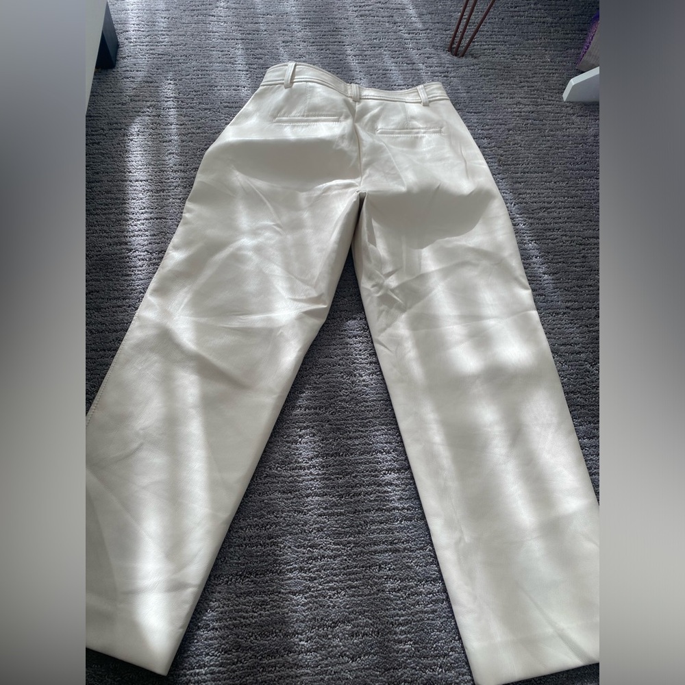 Cream, leather pants